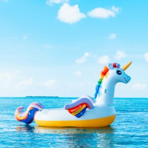 yellow and blue inflatable duck on blue sea under blue sky during daytime